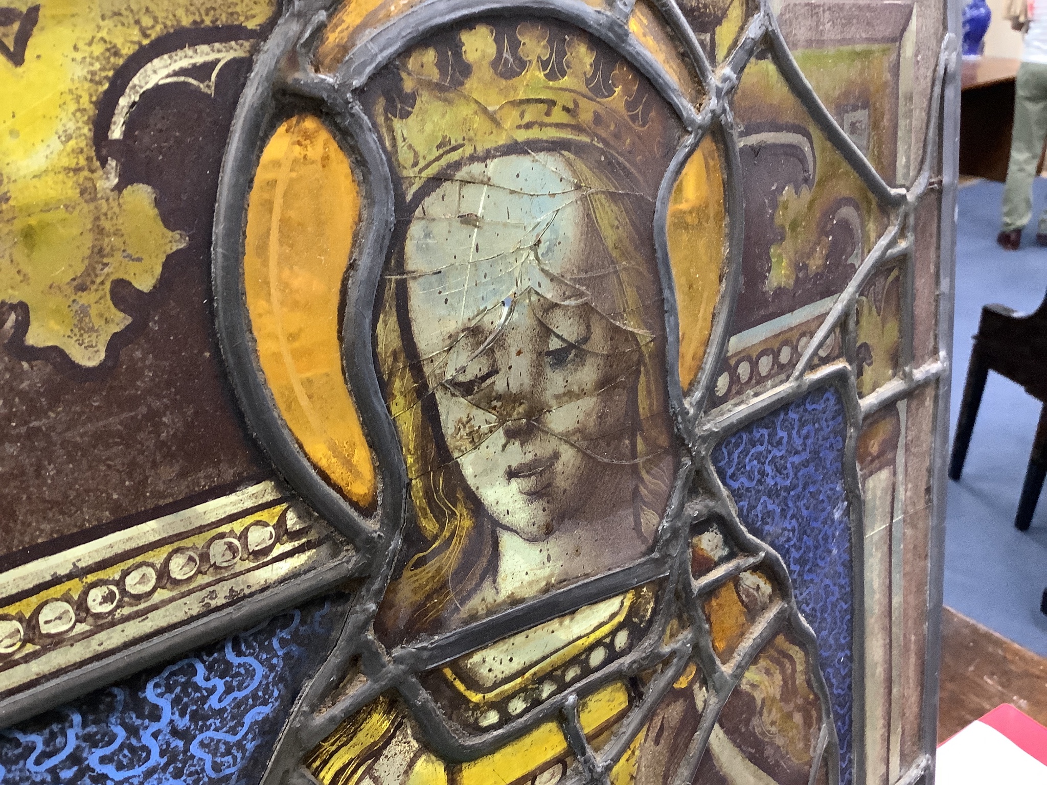 An early 16th century German stained leaded glass panel, depicting St. Catherine holding a sword and a book. 25 x 17.5ins. (later restorations and replacements)